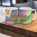 Sonja Ariel von Staden Kunstdruck Tasse / 325 ml Kraftbild: Magische Regenbogen-Feder - Kunstdruck